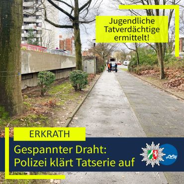 Ein Rad- und Gehweg der von Bäumen gesäumt ist. Ein Drahtseil ist über den Weg gespannt. Ein Polizeiauto steht im Hintergrund.